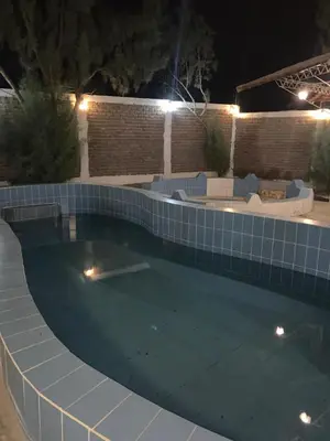 a swimming pool at night with lights in it at Casa de Campo - Fundo Raquel in Ica
