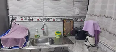 a kitchen with a sink in a caravan at LA POSADA CHASQUI INN en LIMA in Lima