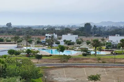 a view of a resort with two swimming pools at Casa en Asia con piscina in Asia