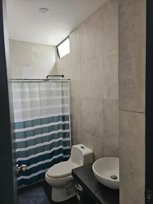 a bathroom with a toilet and a sink and a shower at Casa en Asia con piscina in Asia