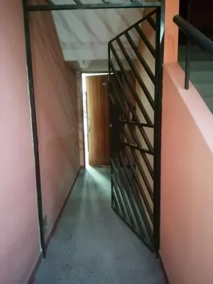 an open door to a hallway in a building at Acogedora Habitacion Independiente in Lima