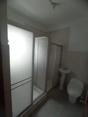 a bathroom with a shower and a toilet at Inti Wasi in Cusco