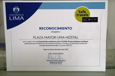 a sign for aisma margarita limo hospital at Plaza Mayor Lima in Lima