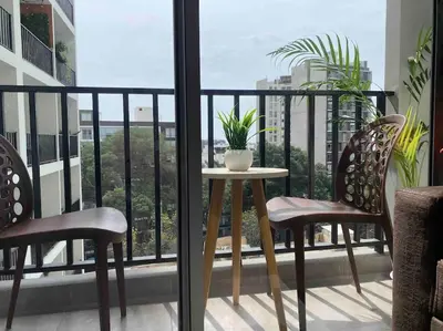a balcony with a table and two chairs on a balcony at Beautiful floor 9th apartment Pool Gym Barranco in Lima