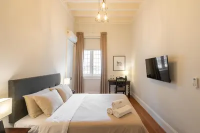 a bedroom with a bed with a towel on it at Casa Cáceres in Lima