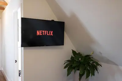 a flat screen tv hanging on a wall at Casa Cáceres in Lima