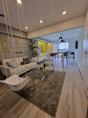 a living room with a couch and a table at Barranco Aparment Luxury in Lima