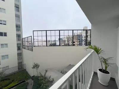 a balcony with a view of a building at Peruvian Apartments Miraflores in Lima