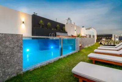 a house with a swimming pool in the yard at Peruvian Apartments Miraflores in Lima