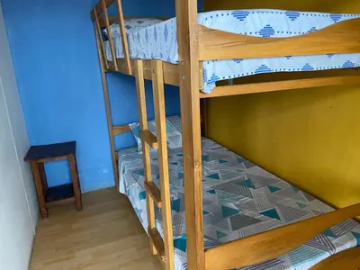 a couple of bunk beds in a room at Villa Alfonso - Casa playa con piscina temperada in Lima