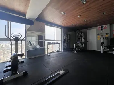 a room with a gym with a large window at Peruvian Apartments Barranco 2004 in Lima