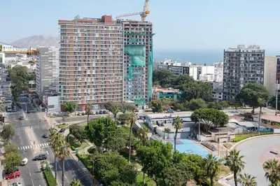 a view of a city with a tall building at Peruvian Apartments Barranco 1606 in Lima