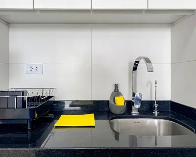 a kitchen with a sink and a faucet at Peruvian Apartments Barranco 1606 in Lima
