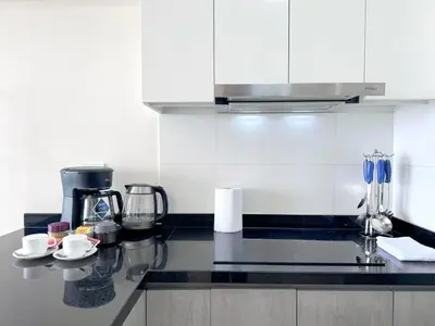 a kitchen with a counter top with a coffee maker at Peruvian Apartments Barranco 1609 in Lima