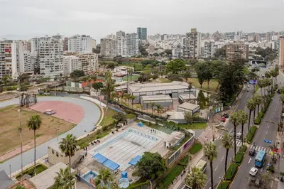 an aerial view of a city with a pool at Peruvian Apartments Barranco 1806 in Lima
