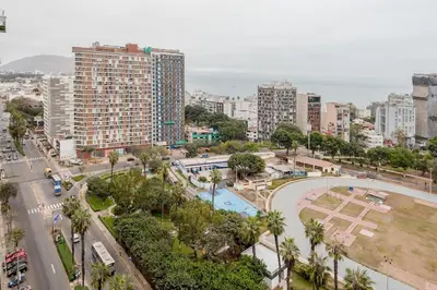 an aerial view of a city with a park at Peruvian Apartments Barranco 1806 in Lima