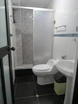 a bathroom with a toilet and a sink and a shower at Hospedaje EL RINCONCITO II - Cerca al Aeropuerto Jauja in Jauja