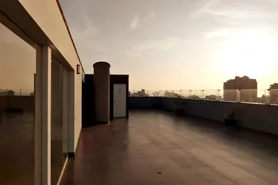 a balcony of a building with a view of the city at Excellent apartment, access to pool, grills, ballroom in Lima