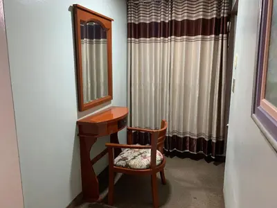 a dressing room with a mirror and a chair at Grand Hotel Betsy in Lima