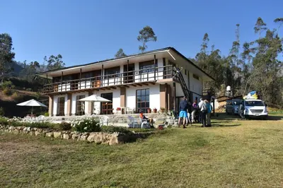 a group of people standing in front of a house at CasaNostra Choquequirao in Cachora