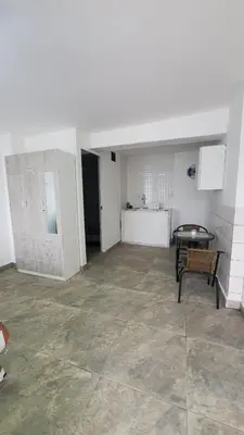 an empty room with a table and a chair at Sanbar House in San Bartolo