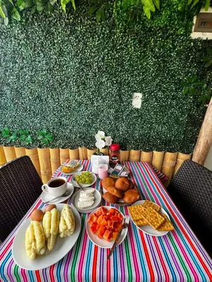 a table with plates of food on top at Golden Paris Hotel 