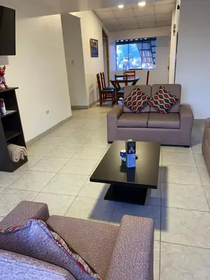 a living room with couches and a coffee table at Adriano's Deluxe Apartments 3 in Cusco