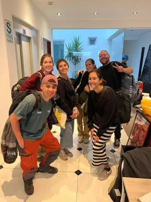 a group of people posing for a picture in a room at The Point Miraflores, Lima in Lima