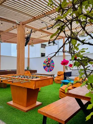a ping pong table in the middle of a room at The Point Miraflores, Lima in Lima