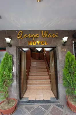 a hotel entrance with a sign that reads lax was hotel at Qosqo Wasi in Cusco