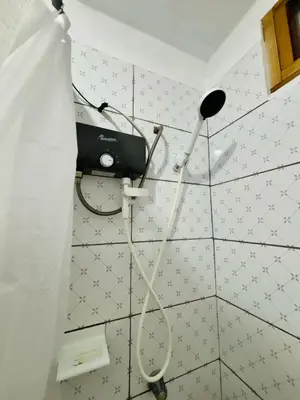 a hair dryer on the wall of a bathroom at Comfortable House in Punta Hermosa