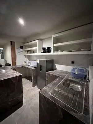 a kitchen with stainless steel appliances and a counter top at Dpto a 3 min Plaza Huánuco y 1 cuadra Open Plaza in Huánuco