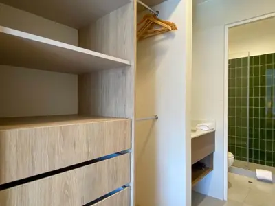 a bathroom with a walk in shower and a toilet at Pod by Wynwood House in Lima