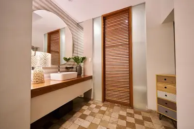 a bathroom with a sink and a mirror at Pucllana BBBoutique in Lima