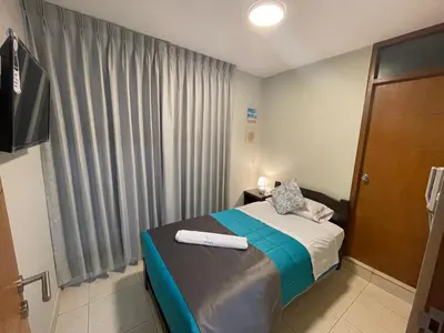 a small bedroom with a bed and a window at Vianca Hotel in Machu Picchu