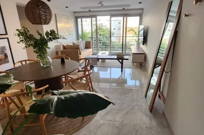 a living room with a table and chairs at Amazing 3BR in Miraflores in Lima