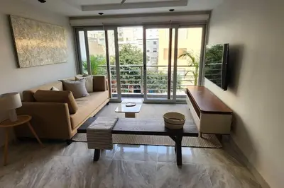 a living room with a couch and a table at Amazing 3BR in Miraflores in Lima