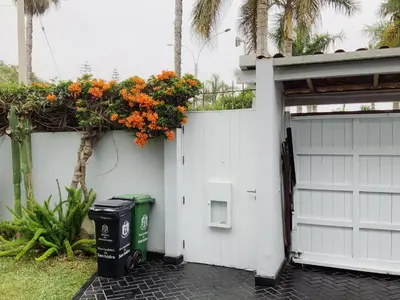 a white garage door with a flower planter on it at Live, Work & Comfort San Isidro in Lima