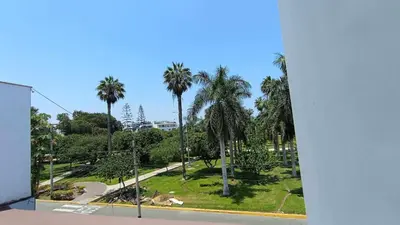 a view of a park with palm trees and a skate park at Live, Work & Comfort San Isidro in Lima