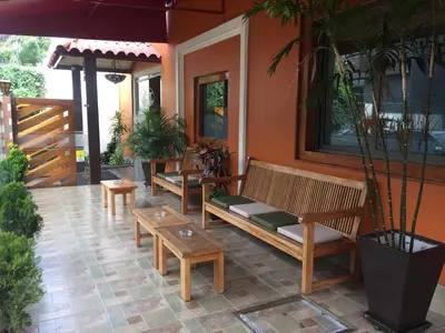 a group of benches sitting on a patio at Hotel Tinkus Inn in Lima