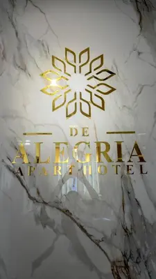 a sign for aantara china studio on a marble wall at Apart Hotel de Alegria in Cusco