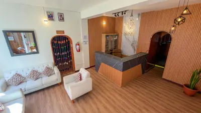 a living room with a couch and a fireplace at Apart Hotel de Alegria in Cusco