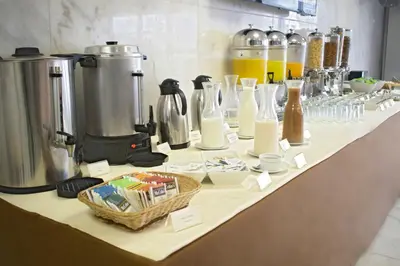 a table with many bottles and containers on it at Luxury Inkari Hotel in Lima