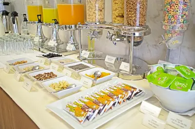 a buffet with different types of food on a table at Luxury Inkari Hotel in Lima