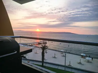 a view of the ocean from a balcony of a resort at Nuevo Paracas Apartment in Paracas