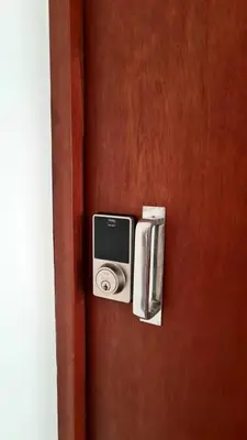 a door with a speaker on a wooden door at Dormitorio matrimonial 02 in Lima
