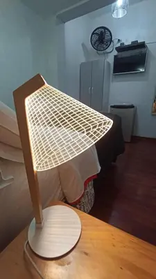 a lighted lamp on a table in a room at Casita Libertad Barranco in Lima