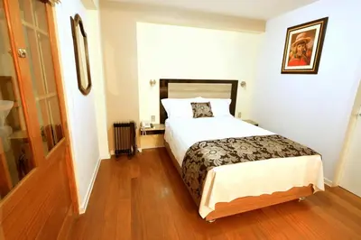 a bedroom with a large bed in a room at Tandapata Boutique Hotel in Cusco