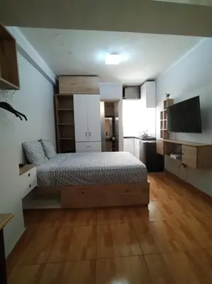 a bedroom with a bed and a television in it at Apartamento estándar en Lima Centro in Lima
