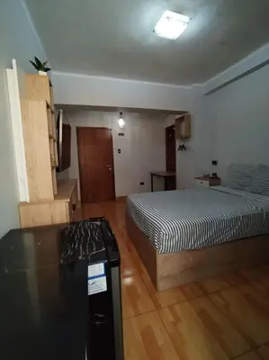 a bedroom with a bed and a stove in it at Apartamento estándar en Lima Centro in Lima